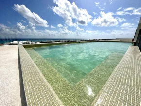 2BR Modern Condo with Rooftop Pool - Prime Location by Solmar Rentals